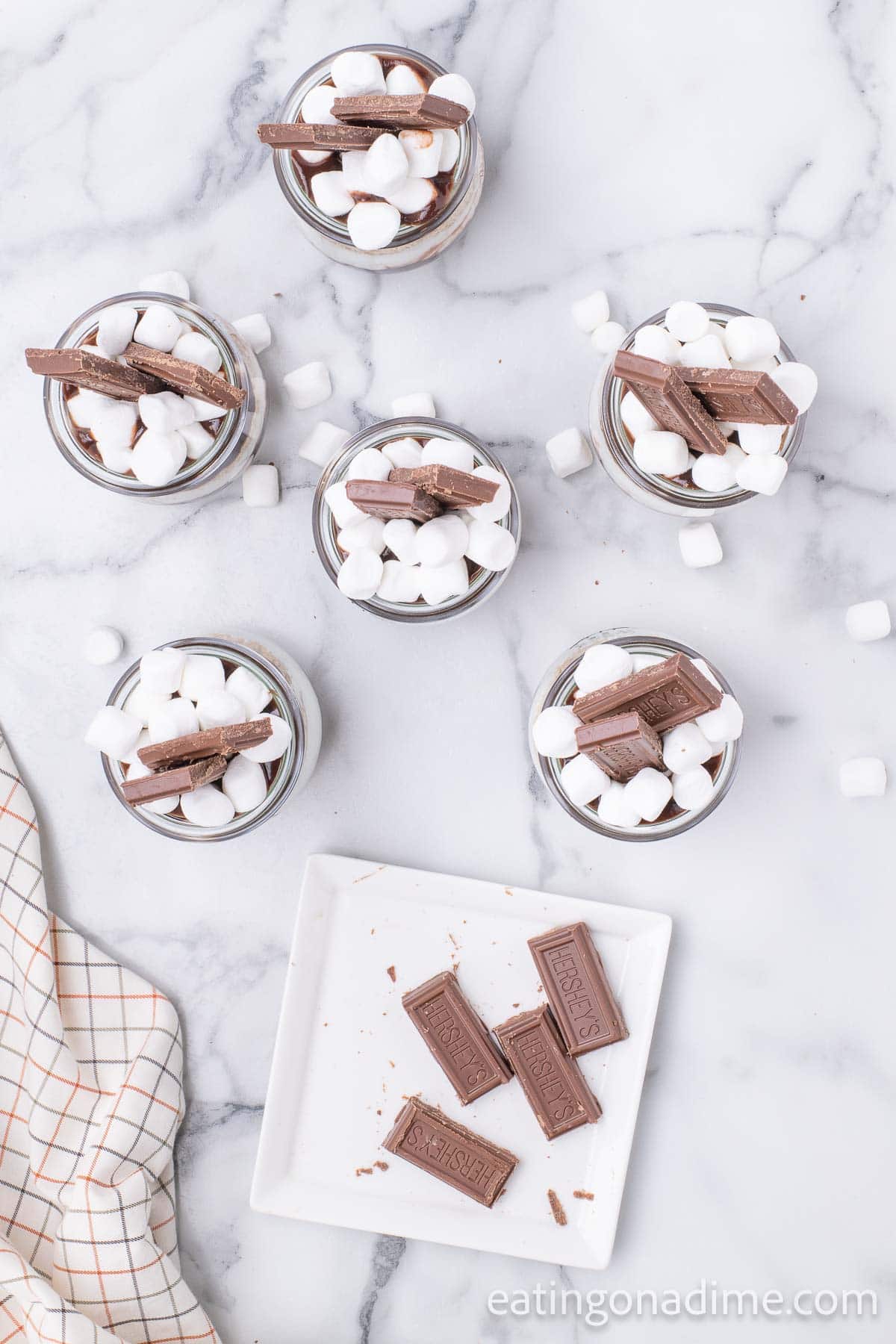 Topping jars with marshmallows and chocolate bars
