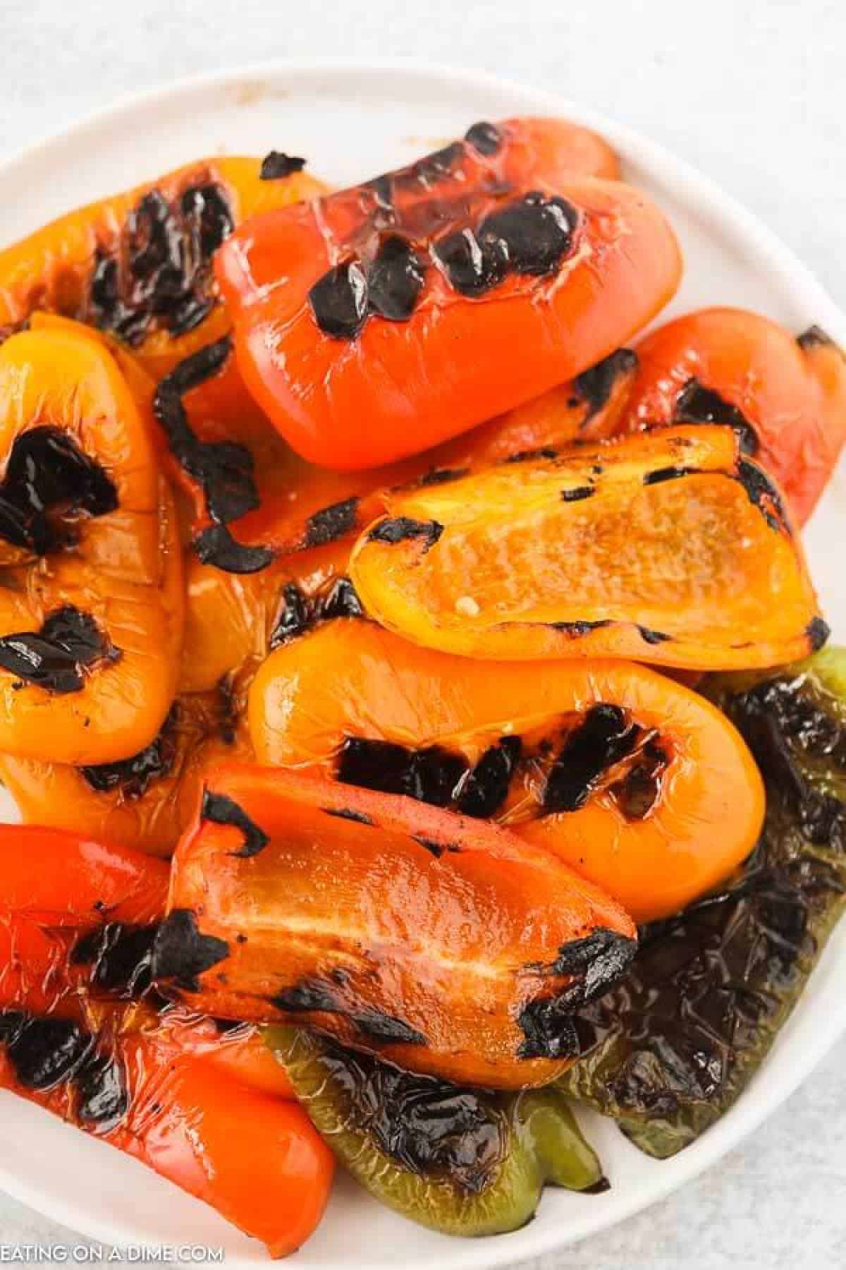 Learn how to grill bell peppers for the perfect side dish for chicken, fish and more. The grill makes this tasty with perfectly crispy edges. 