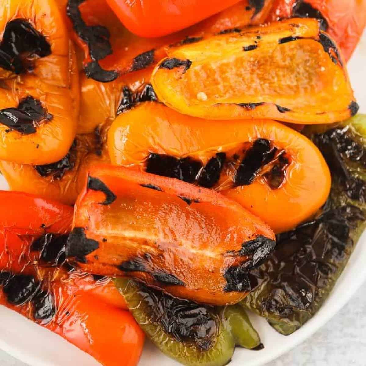 Learn how to grill bell peppers for the perfect side dish for chicken, fish and more. The grill makes this tasty with perfectly crispy edges. 
