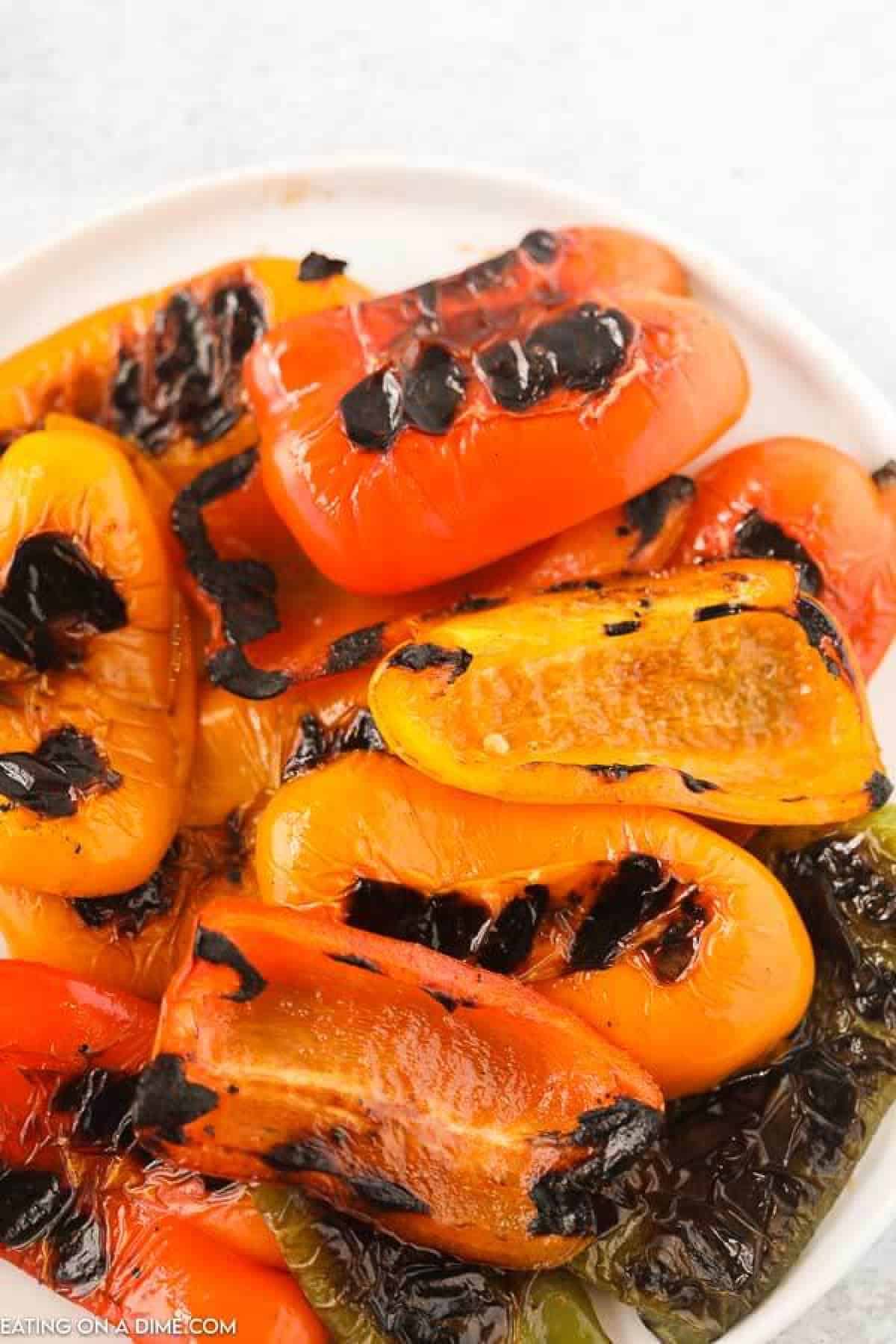 Learn how to grill bell peppers for the perfect side dish for chicken, fish and more. The grill makes this tasty with perfectly crispy edges. 