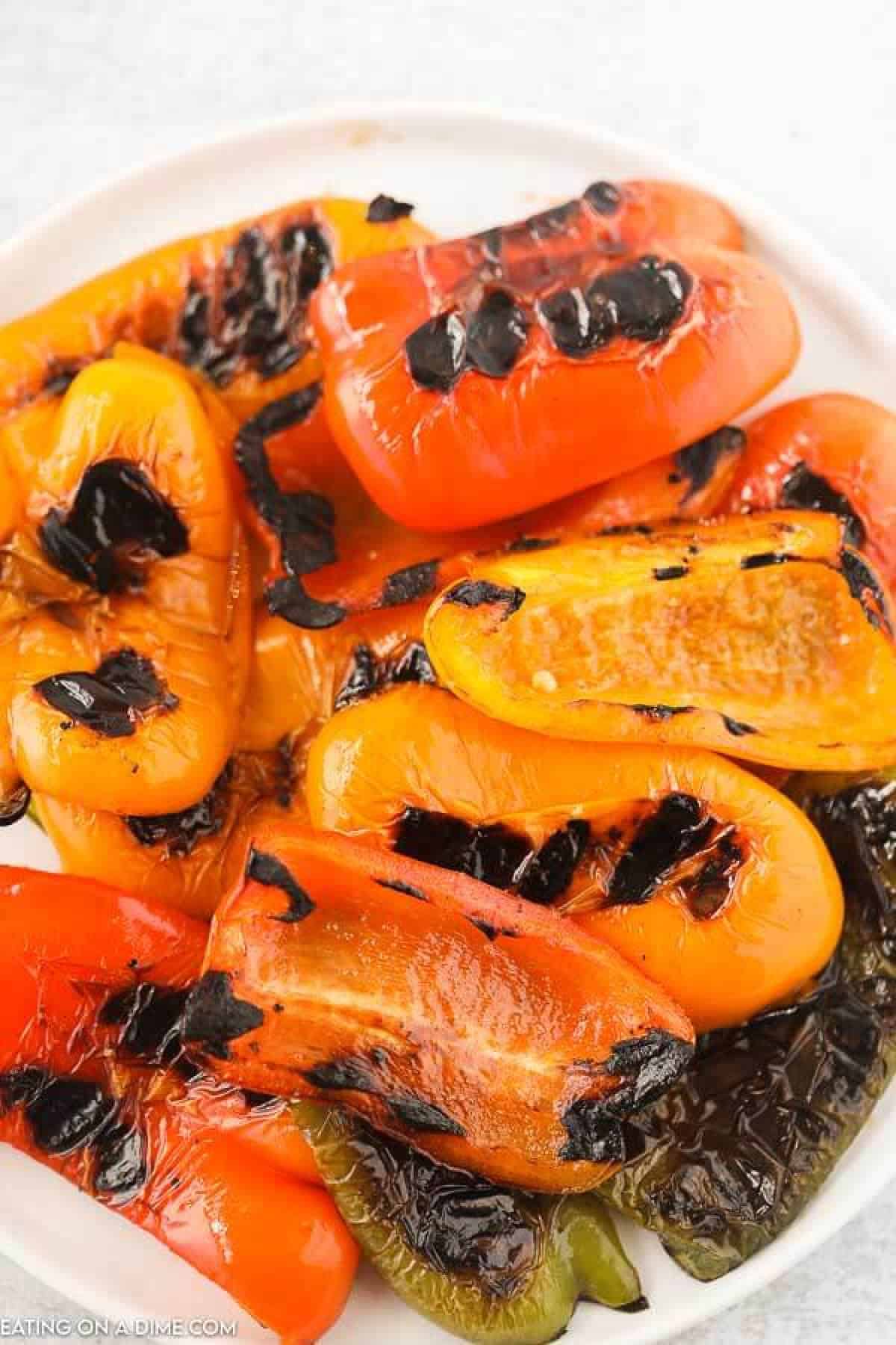 Learn how to grill bell peppers for the perfect side dish for chicken, fish and more. The grill makes this tasty with perfectly crispy edges. 