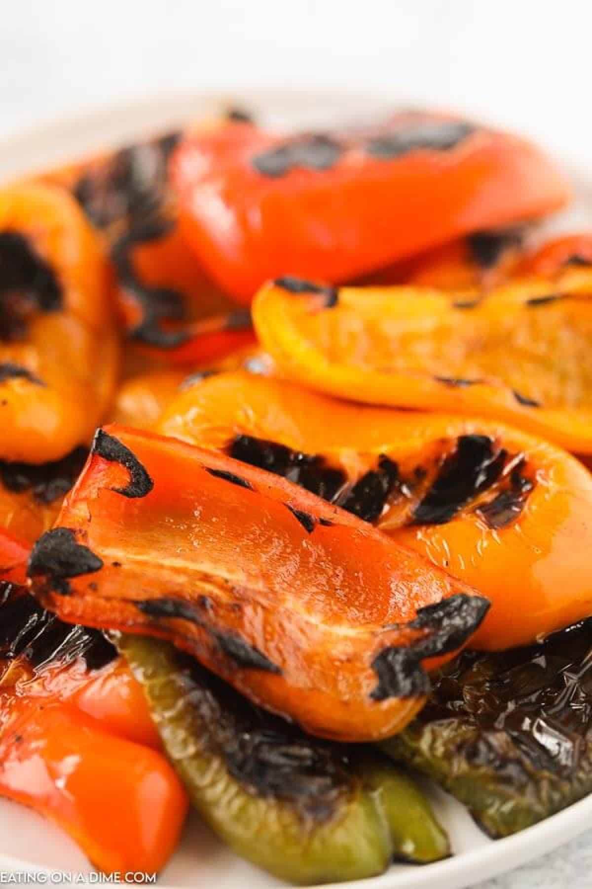 Learn how to grill bell peppers for the perfect side dish for chicken, fish and more. The grill makes this tasty with perfectly crispy edges. 