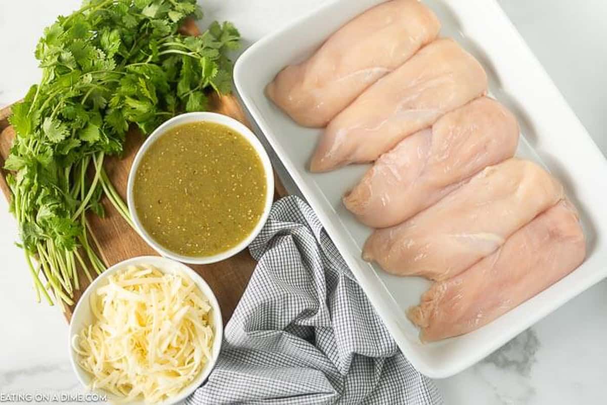 Ingredients to make Salsa Verde Chicken: Chicken Breasts, Salsa Verde and Shredded Monterey Jack Cheese