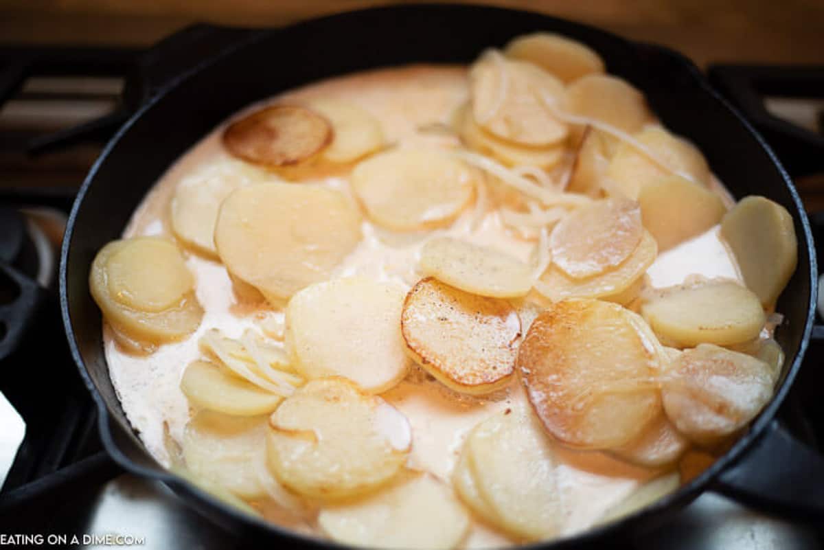 Cream Mixture added to the potatoes and onions - heating to bring to a boil