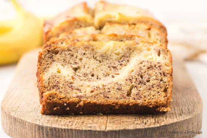 slices of cream cheese banana bread on cutting board