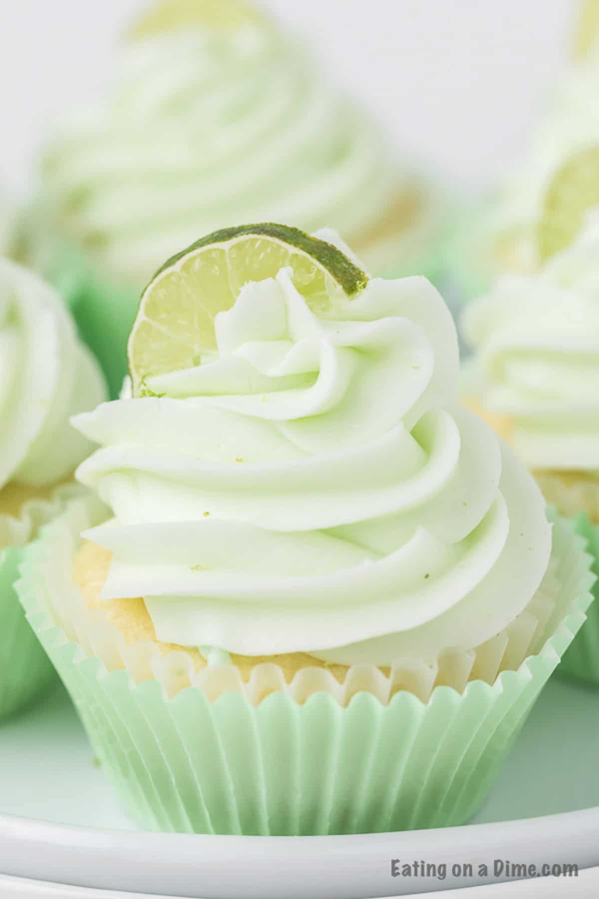 Key Lime Cupcake topped with frosting and a slice of lime wedge