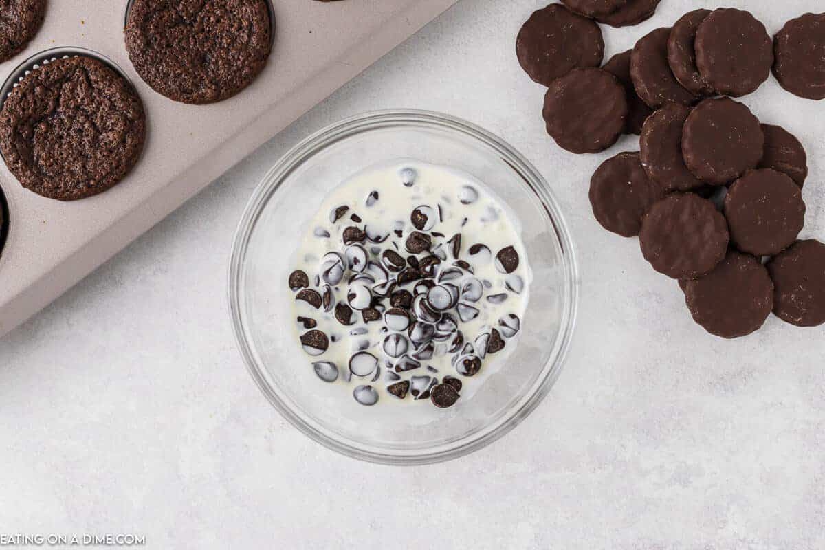 Placing heavy cream and chocolate chips in a bowl