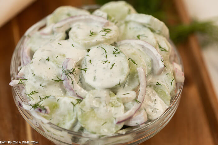Creamy Cucumber and Red Onion Salad in a Clear Bowl 