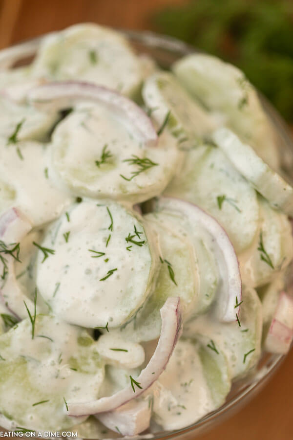 Creamy Cucumber and Red Onion Salad in a Clear Bowl 