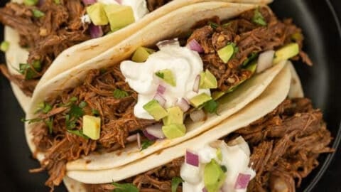 mexican shredded beef tacos on plate