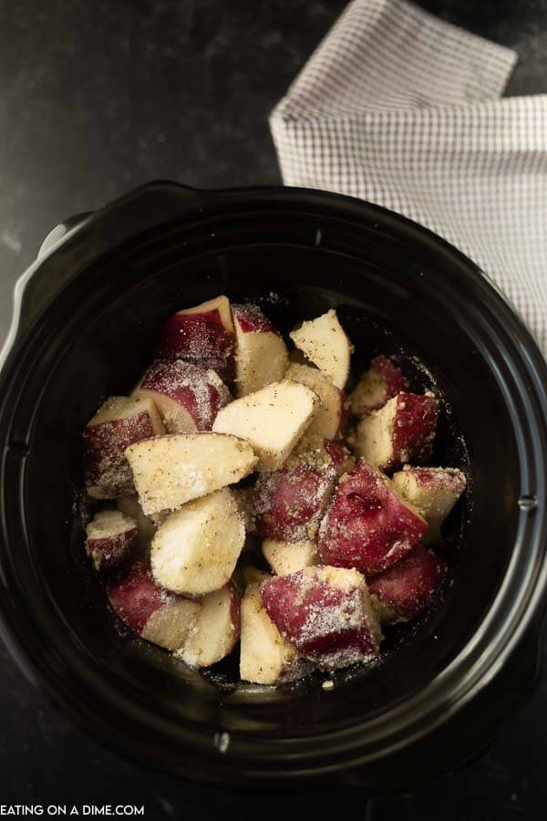 picture of potatoes in crock pot before being cooked