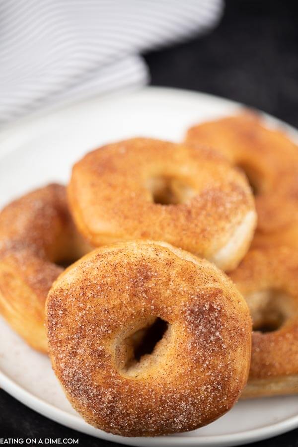 Close up image of donuts on a white plate. 