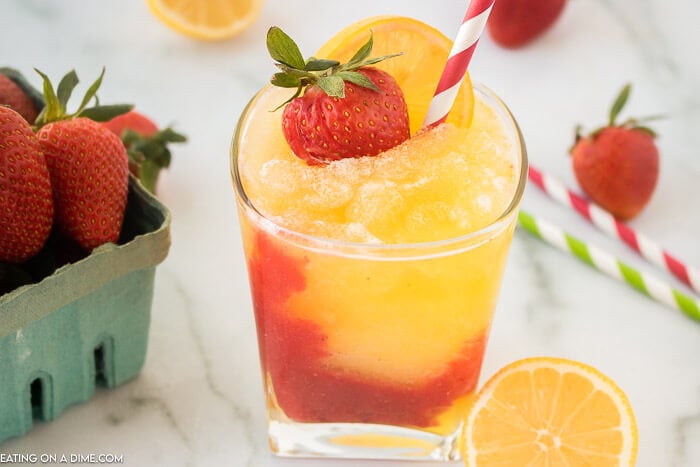 Closeup picture of frozen strawberry lemonade in glass.