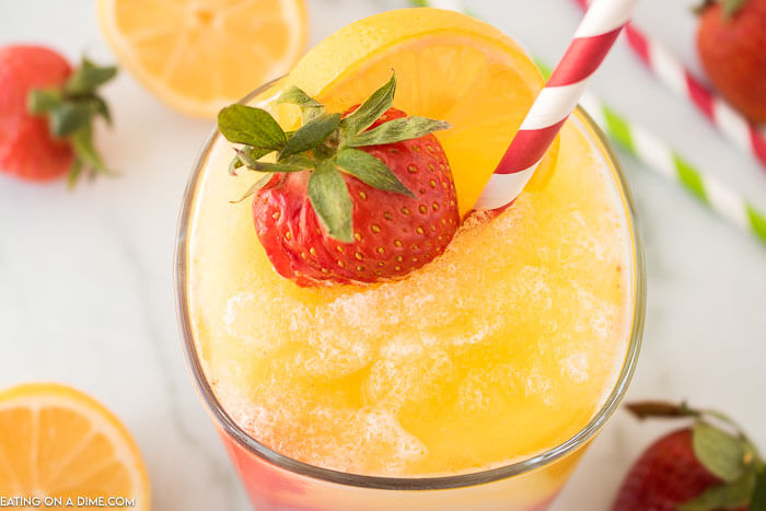 Closeup picture of frozen strawberry lemonade in glass.