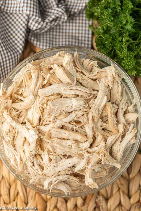 shredded chicken in glass bowl