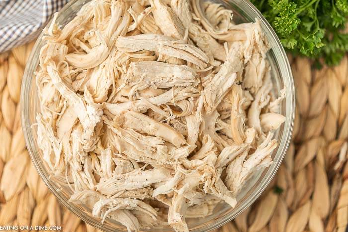 shredded chicken in a glass bowl