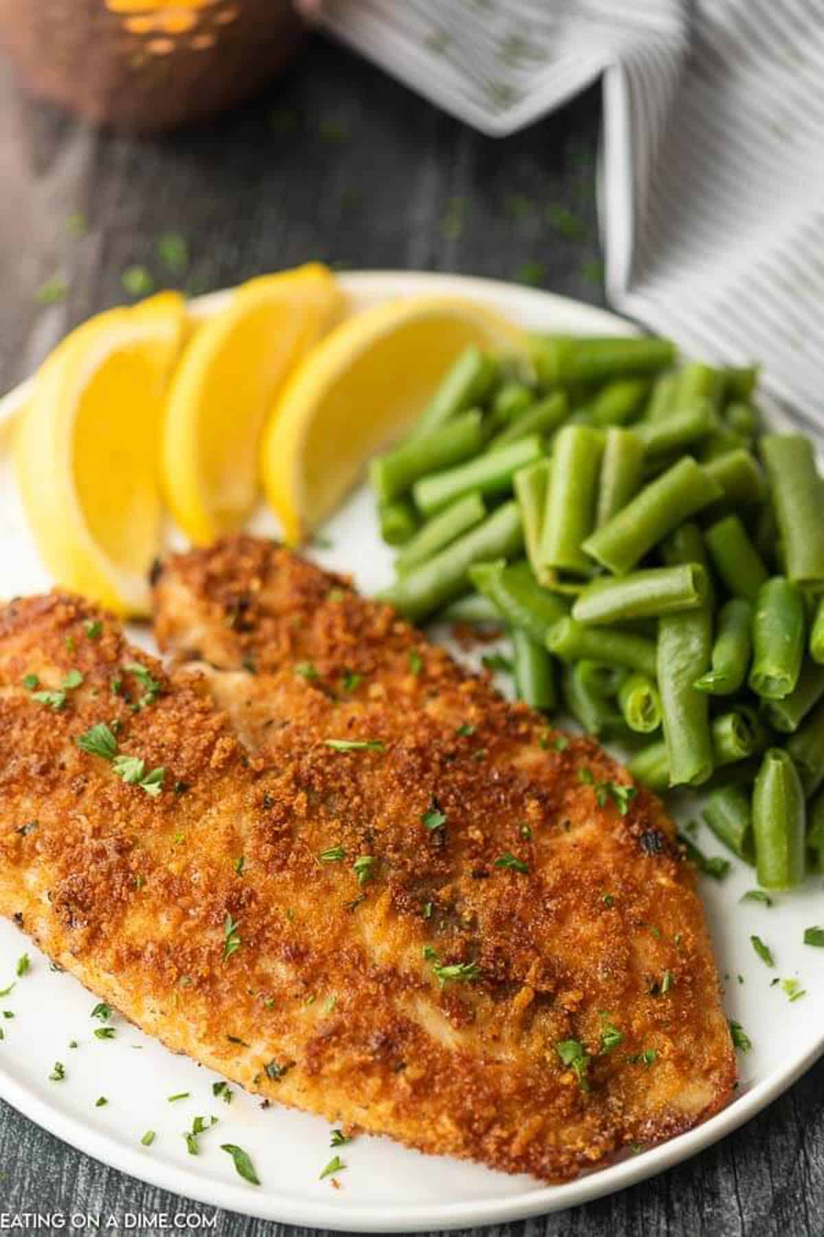 Enjoy crispy and delicious fish without frying or extra oil when you make this easy baked parmesan crusted tilapia. It is a family favorite.