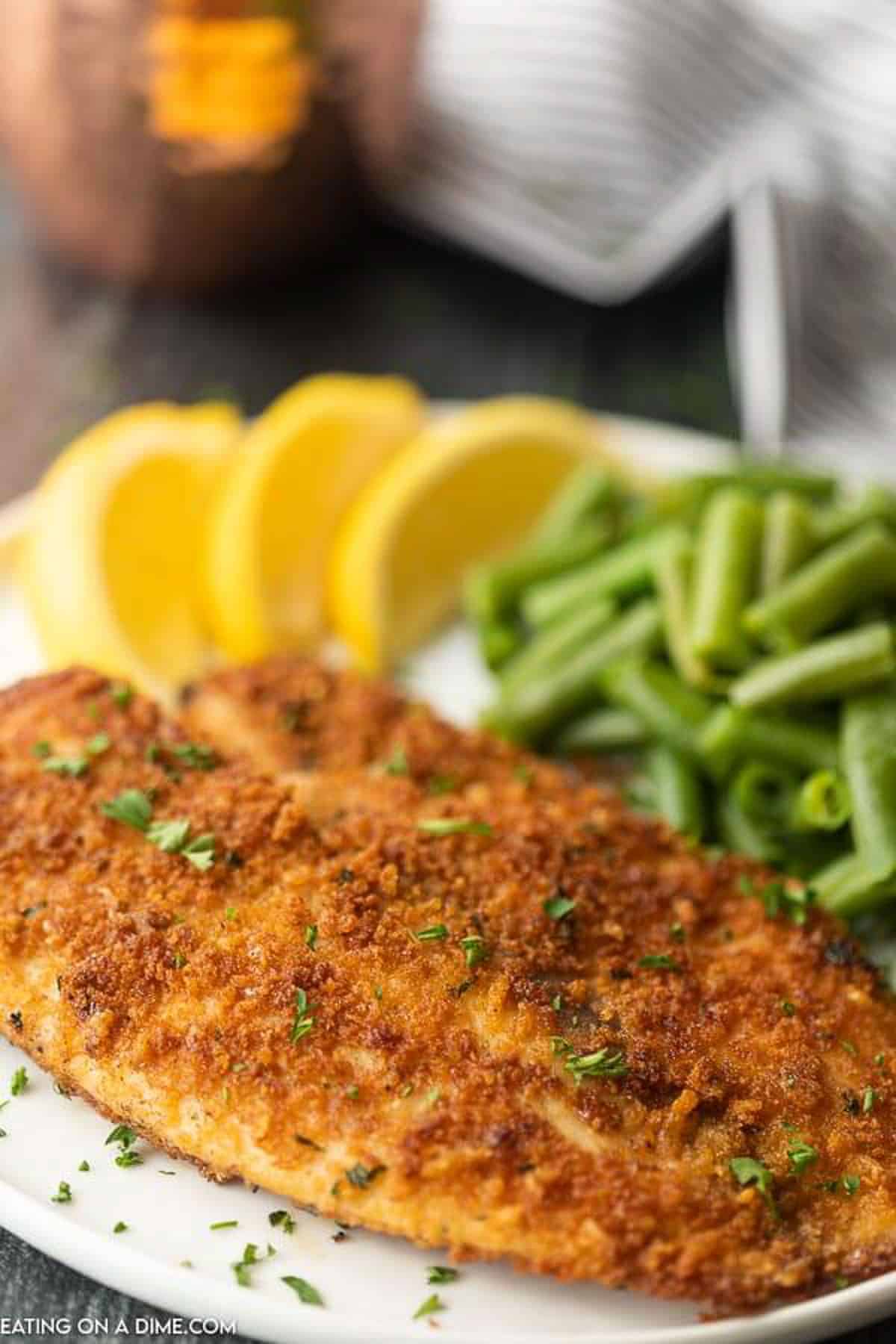 Enjoy crispy and delicious fish without frying or extra oil when you make this easy baked parmesan crusted tilapia. It is a family favorite.