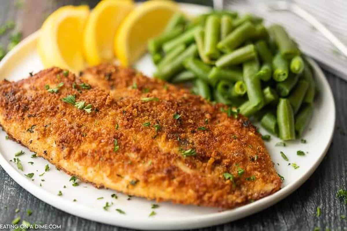 Enjoy crispy and delicious fish without frying or extra oil when you make this easy baked parmesan crusted tilapia. It is a family favorite.