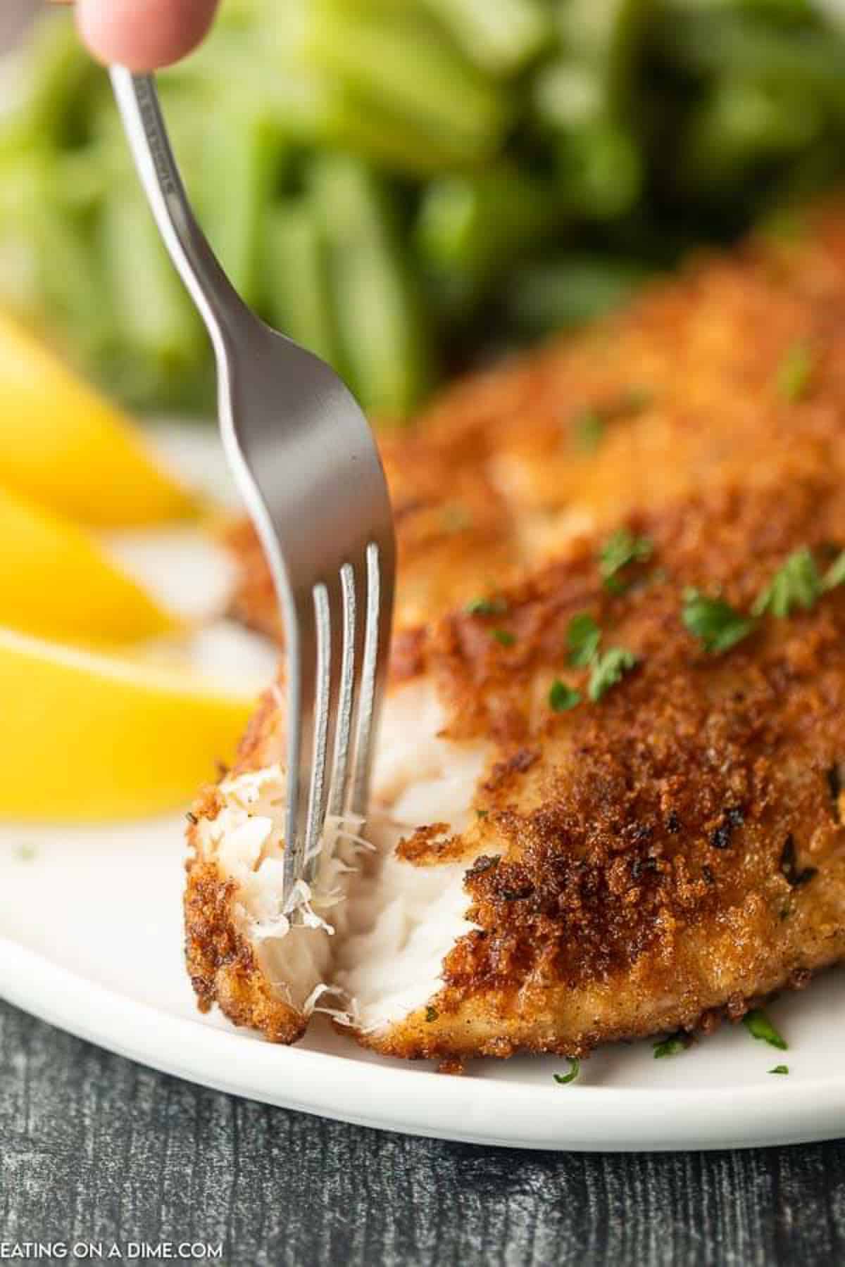 Enjoy crispy and delicious fish without frying or extra oil when you make this easy baked parmesan crusted tilapia. It is a family favorite.