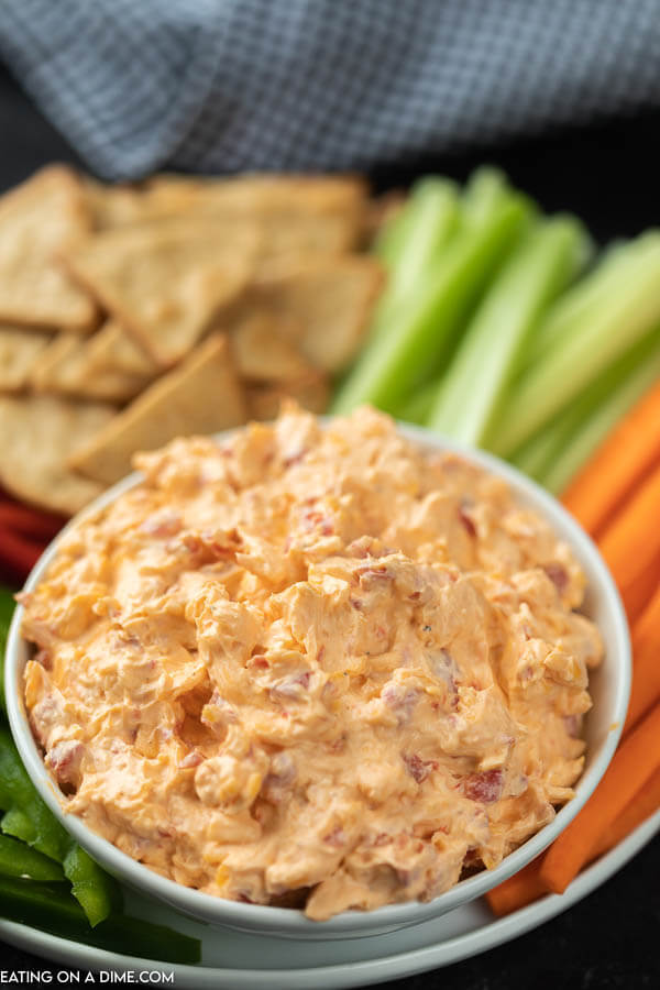 pimento cheese in bowl with veggies around it