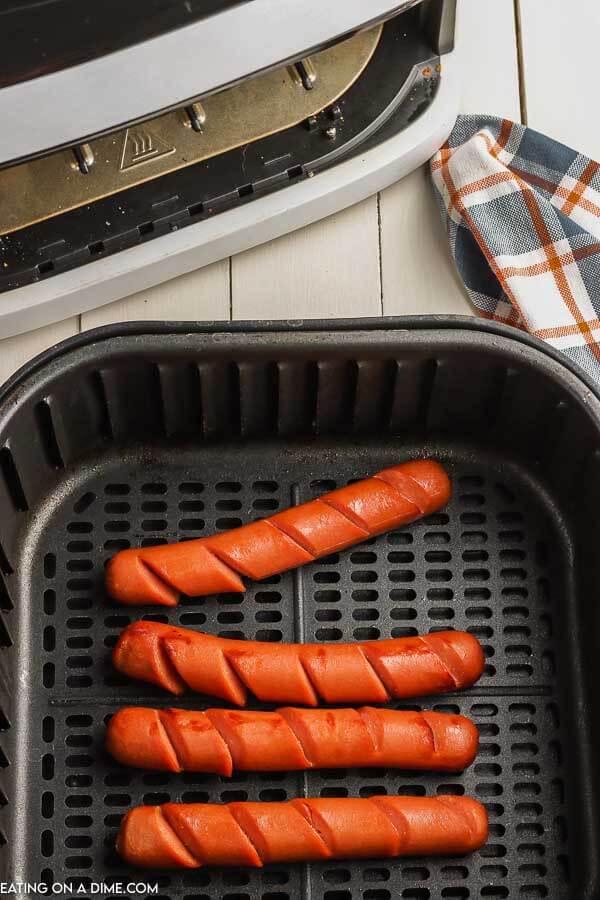 Close up image of hot dogs in the air fryer