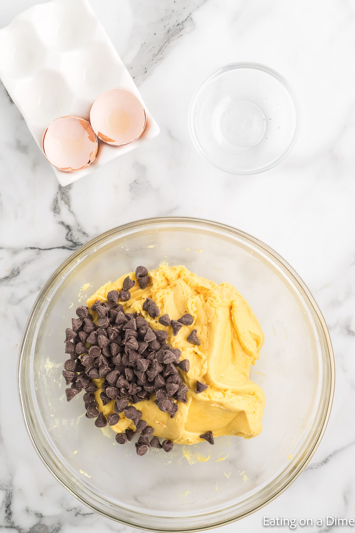 Mixing in the chocolate chips into the cookie dough