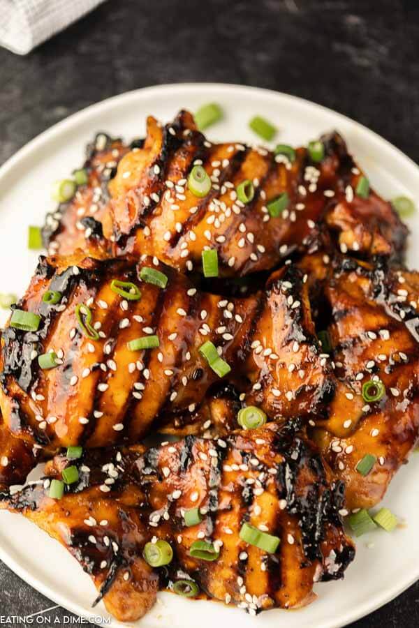closeup photo of grilled teriyaki chicken on plate. 