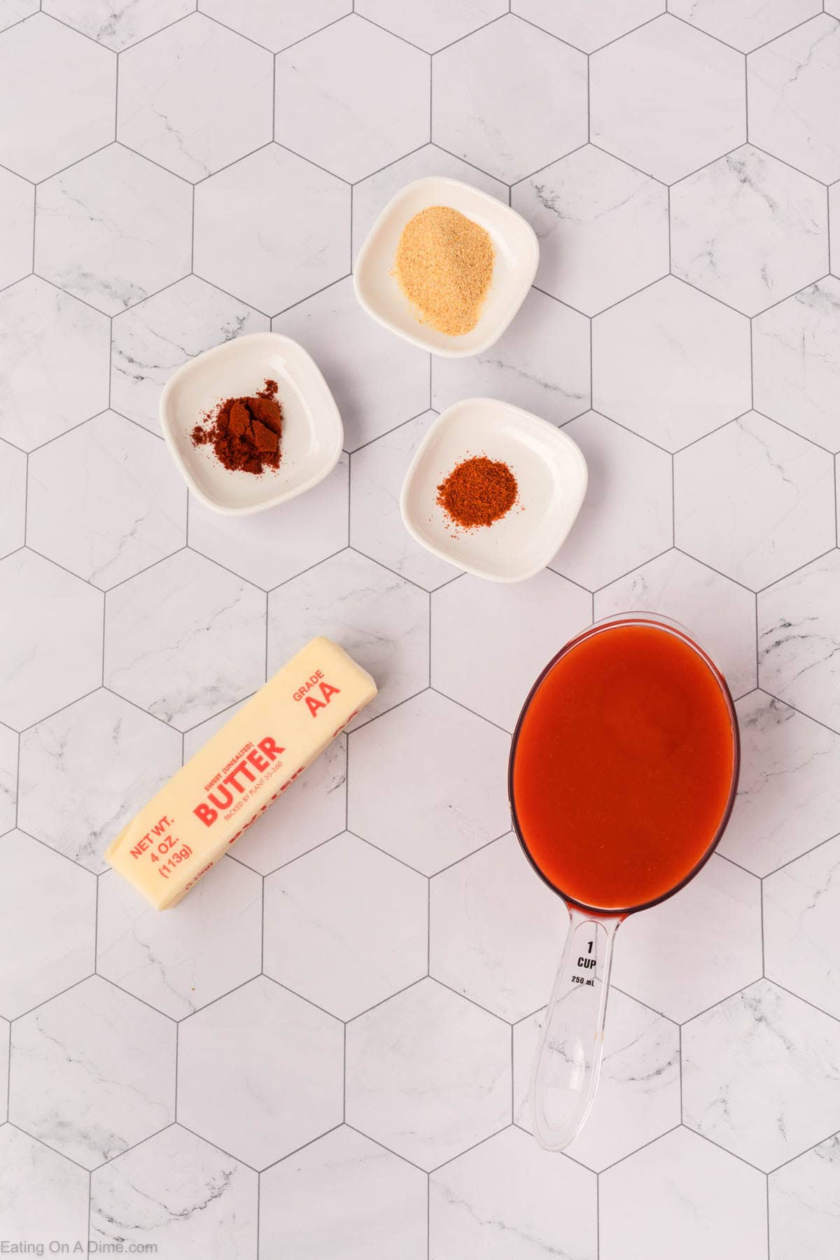 Ingredients - Hot Sauce, unsalted butter, garlic powder, paprika, cayenne pepper