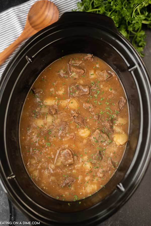 crockpot of steak and potatoes stew
