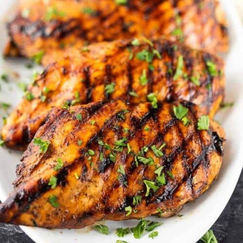 Balsamic glazed chicken is the perfect blend of tangy and sweet while being so easy. We love to grill the chicken but it can also be baked.  