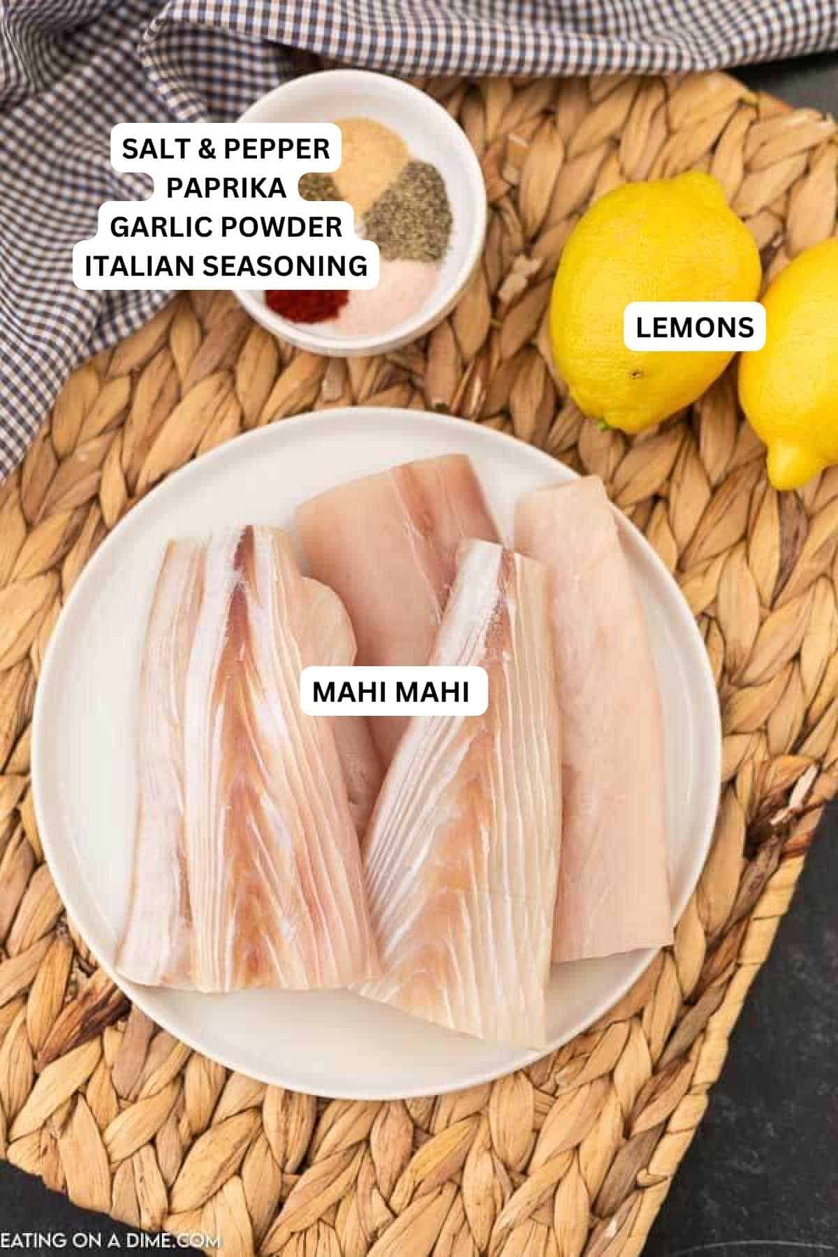 Ingredients for recipe: salt, pepper, paprika, garlic powder, Italian seasoning, lemons and mahi mahi.