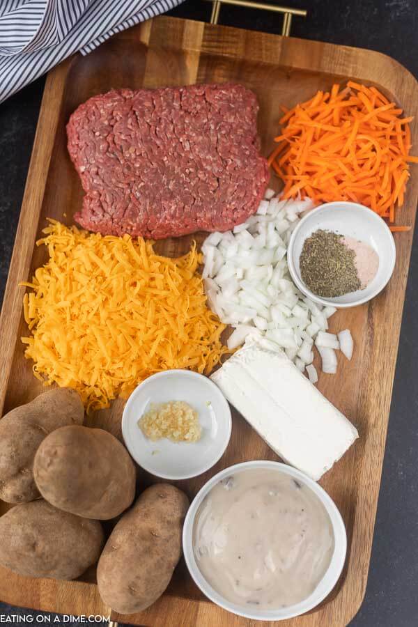 ingredients for recipe: ground beef, carrots, cheese, onion, seasoning, cream cheese, potatoes, cream of mushroom soup