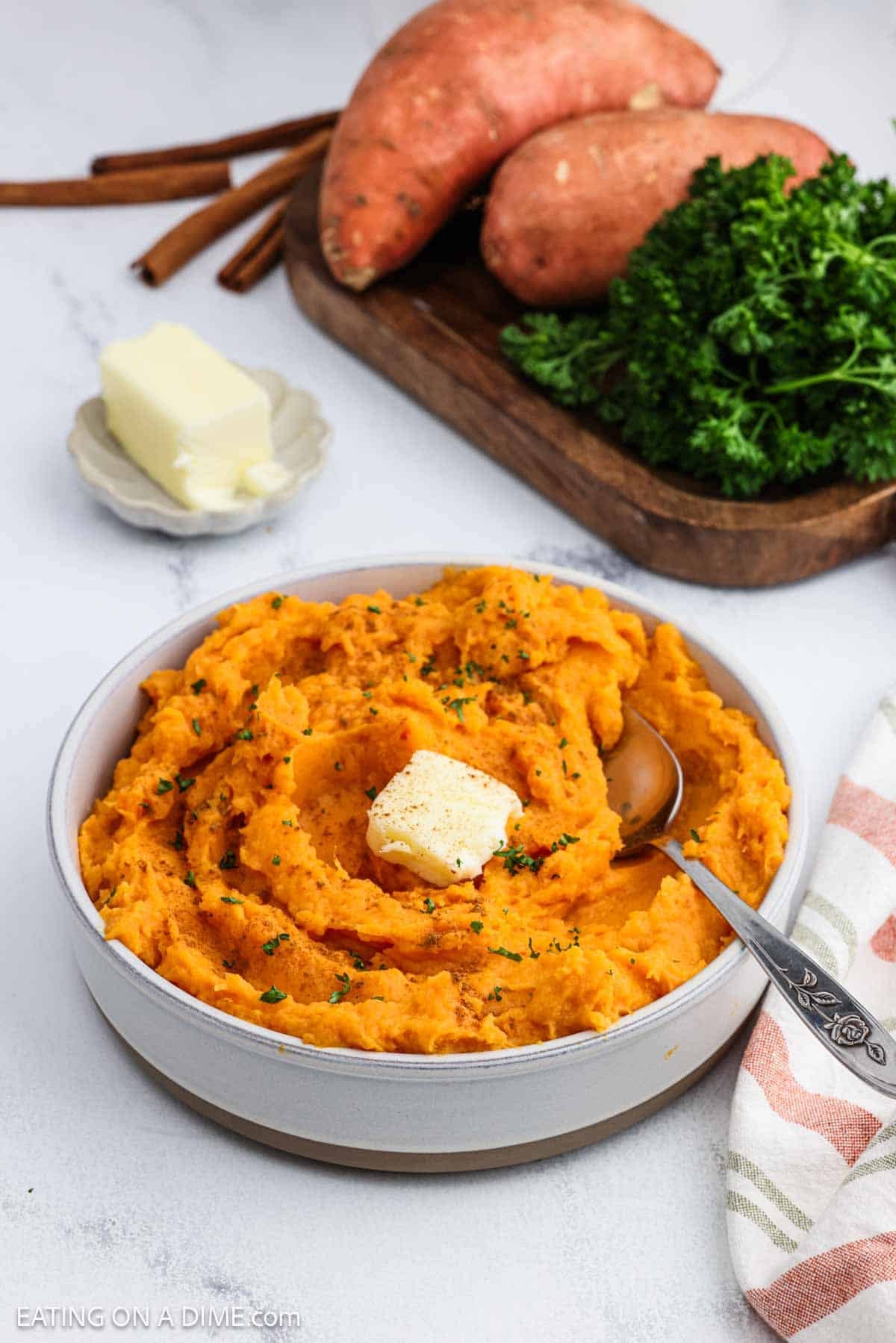 Recipe ready to serve in a large bowl topped with butter.