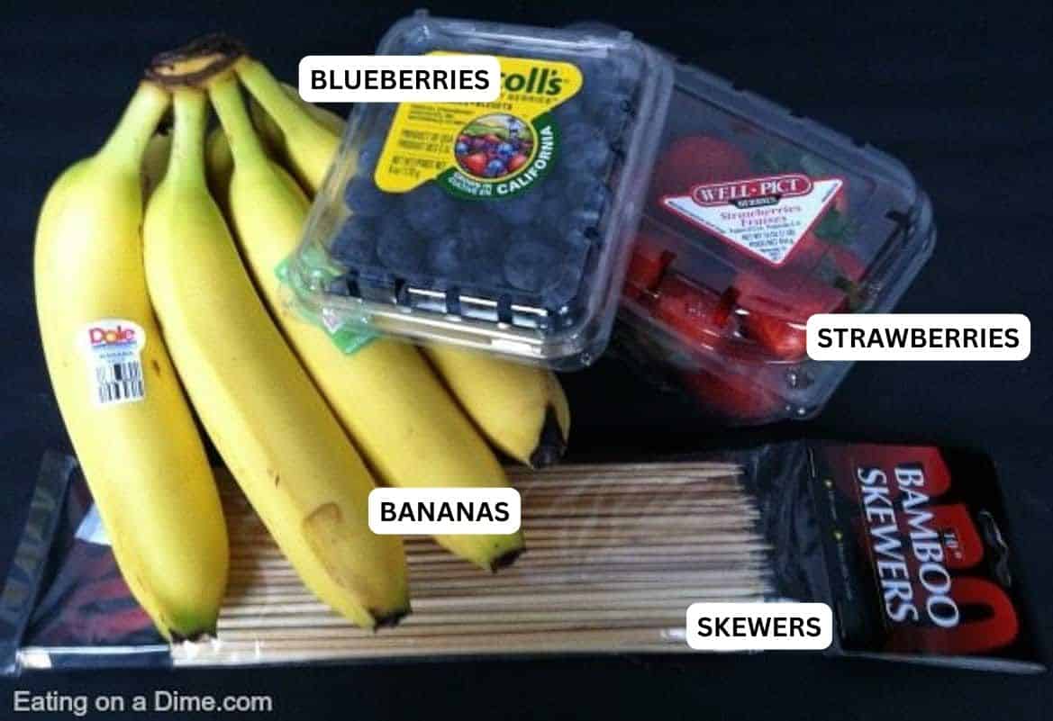 Ingredients to make 4th of July Fruit Kabobs: Bananas, blueberries, strawberries and wooden skewers.