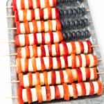 Platter of fruit skewers in flag design.