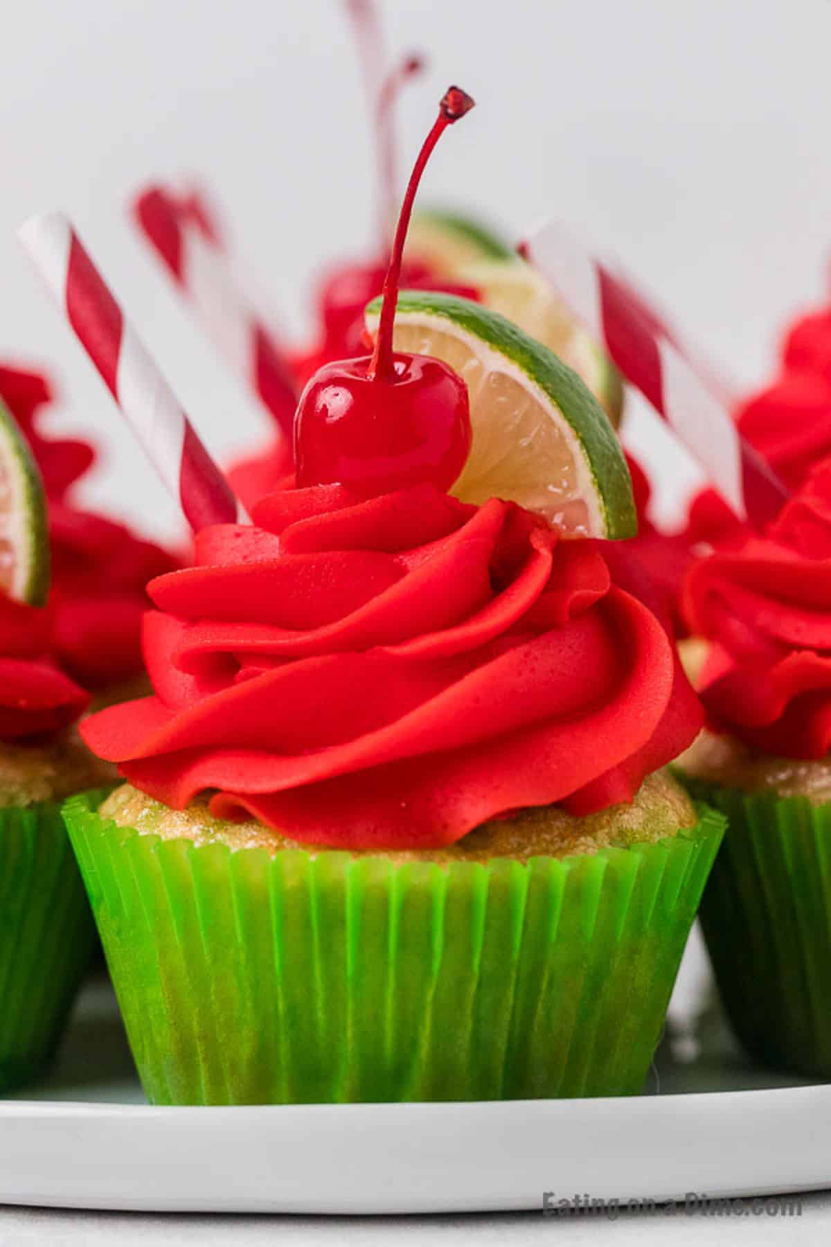 Closeup picture of cherry limeade cupcake in a green cupcake liner