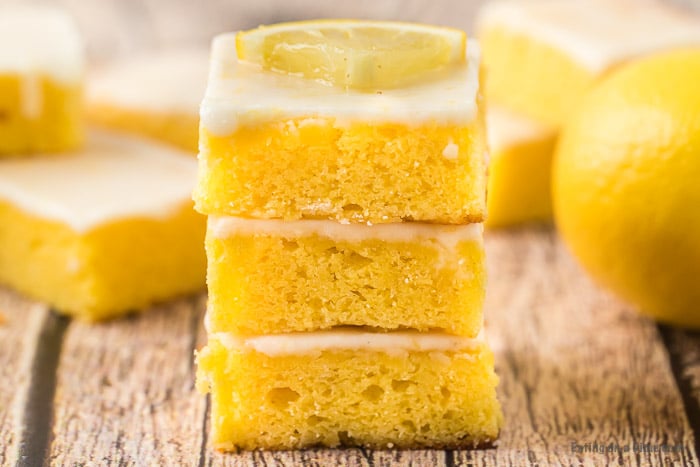Close up image of lemon brownies stacked. 