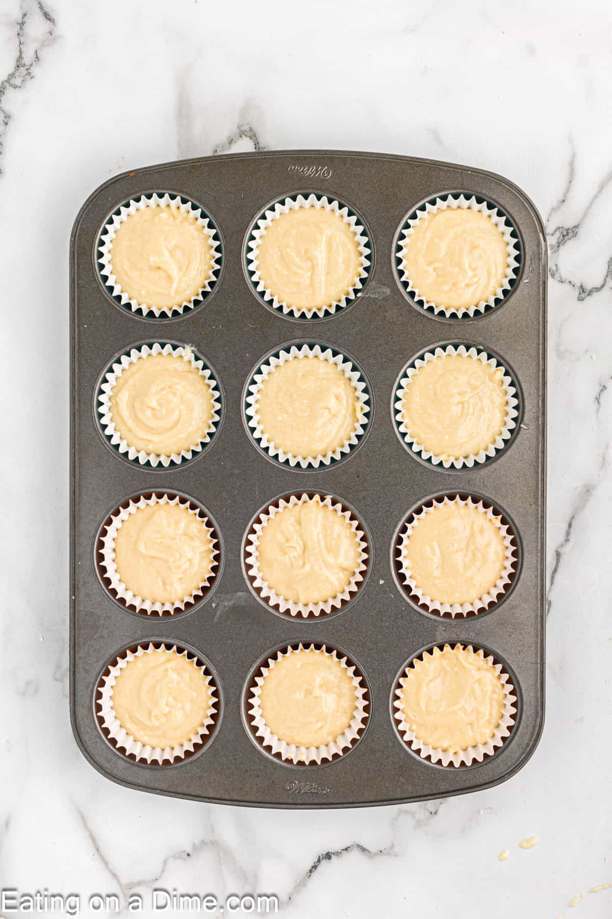 Scoop the cupcake batter in a muffin tin