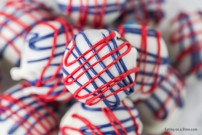 close up photo of patriotic oreo truffles on a plate