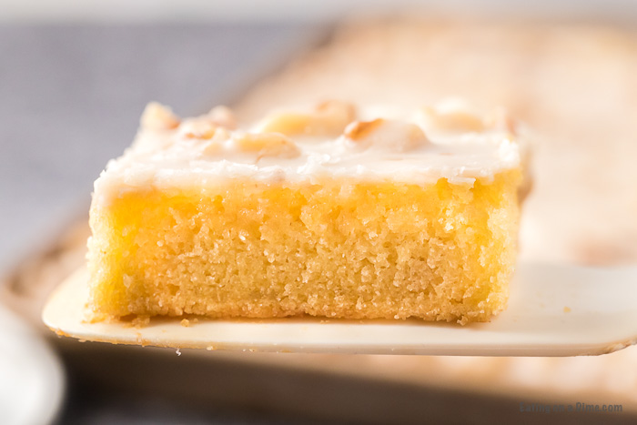 Close up image of a slice of white texas sheet cake. 