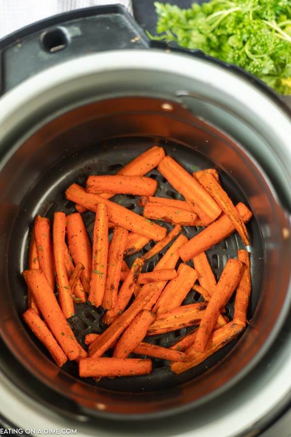 Cooked carrots in the air fryer basket