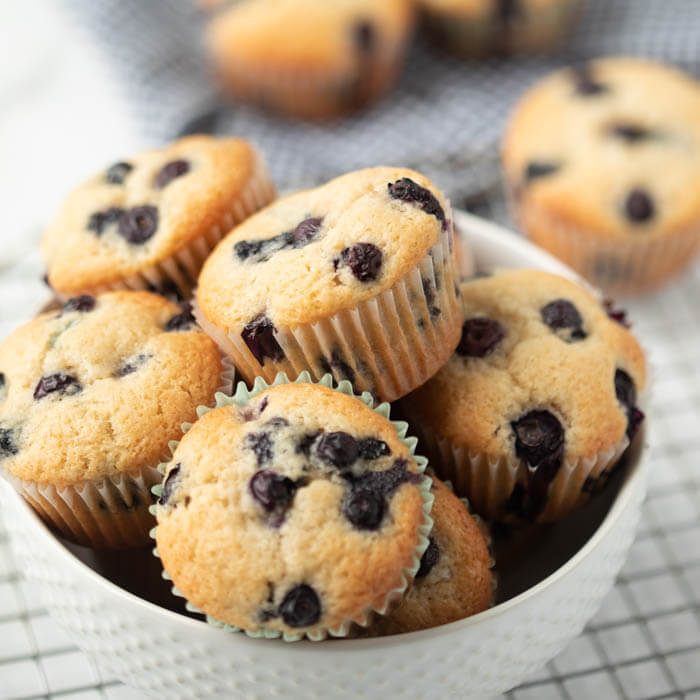 A bowl of blueberry muffins. 