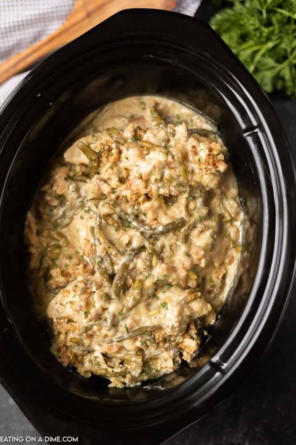Close up image of chicken and stuffing in a crock pot