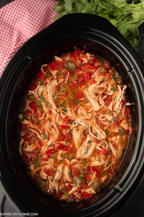 Chicken fajita soup cooked in a crock pot and topped with fresh chopped cilantro 