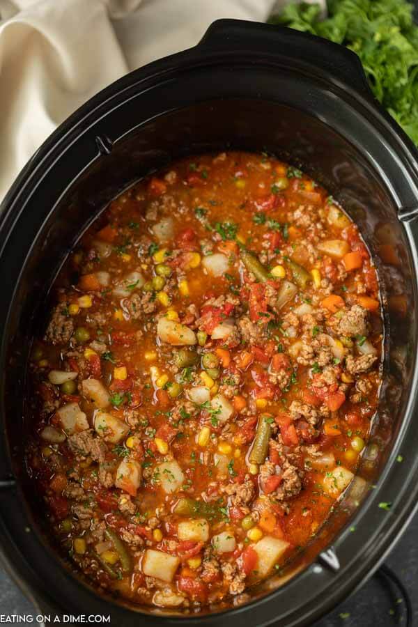 A crock pot full of Vegetable Beef Soup 