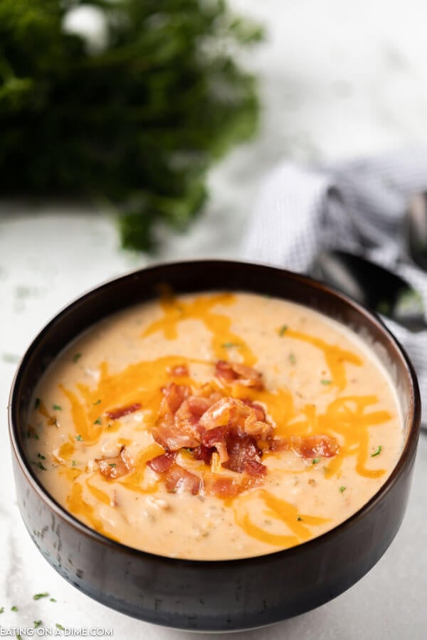 bowl of crack potato soup topped with bacon and cheese