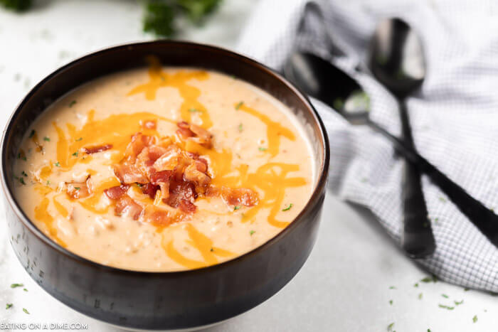 bowl of slow cooker crack potato soup with bacon and cheese