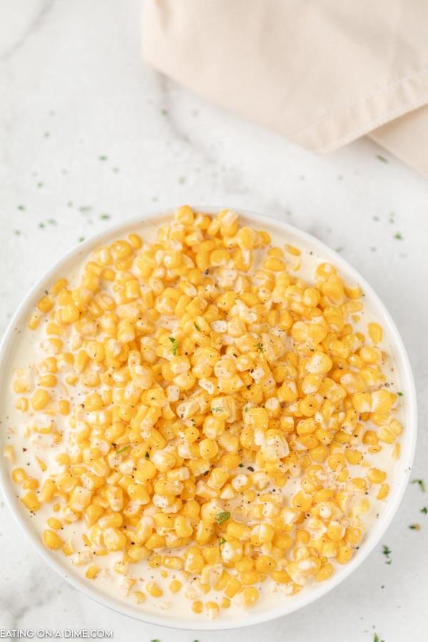 Close up image of Creamed Corn in a white bowl. 