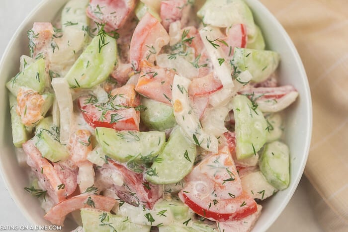 Cucumber Tomato Salad in a white bowl 